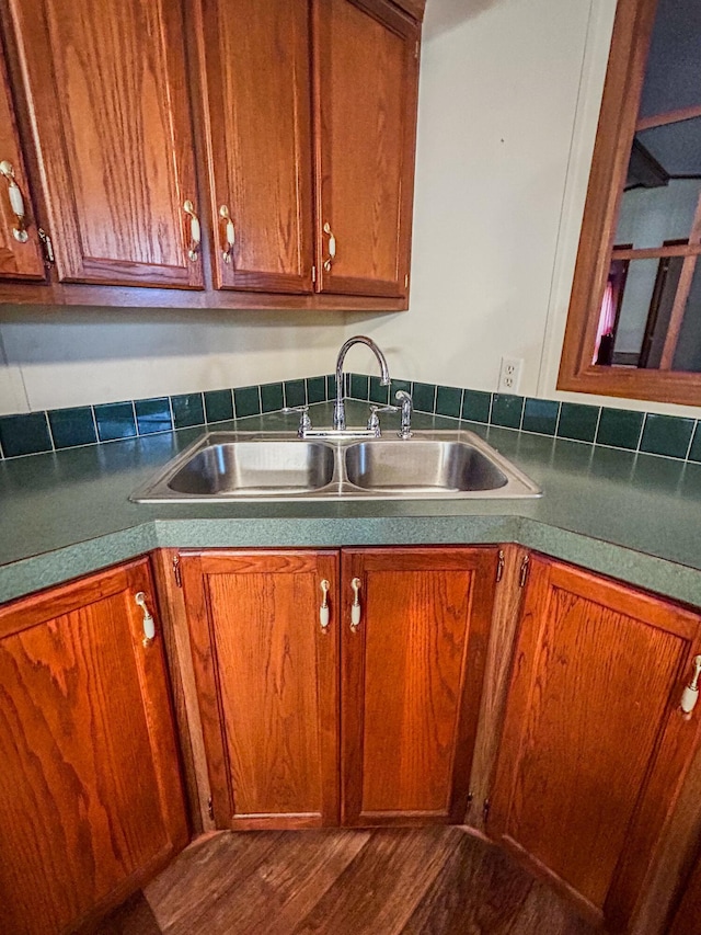 kitchen with hardwood / wood-style floors and sink