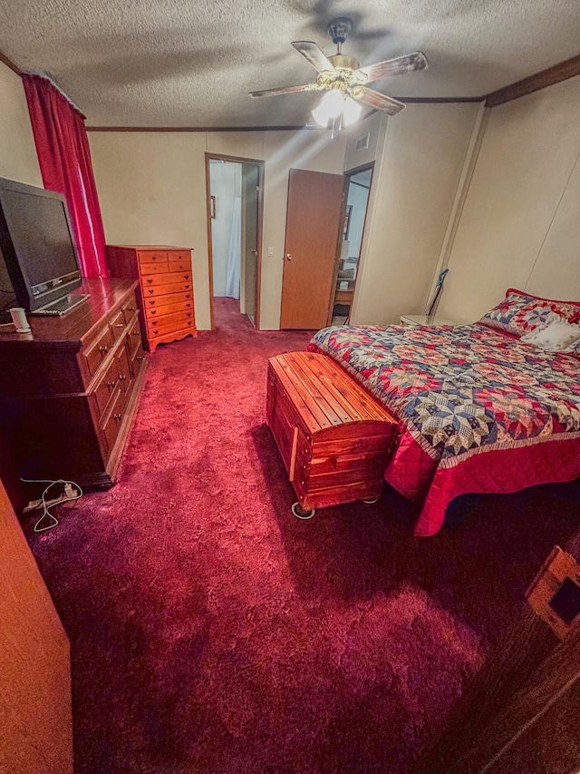 carpeted bedroom featuring a textured ceiling and ceiling fan