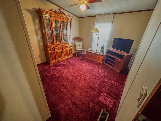 living area featuring ceiling fan, dark carpet, a textured ceiling, and vaulted ceiling