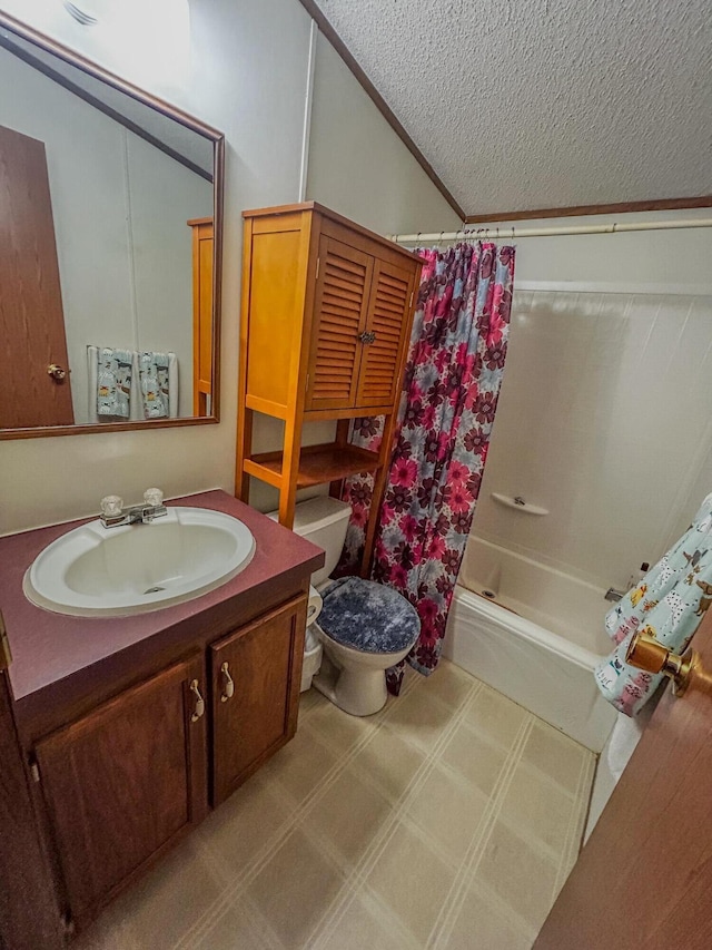 full bathroom featuring shower / bath combination with curtain, vanity, a textured ceiling, vaulted ceiling, and toilet