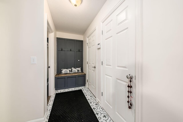 doorway to outside featuring a textured ceiling