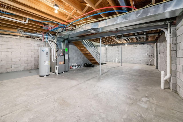 basement with heating unit and electric water heater