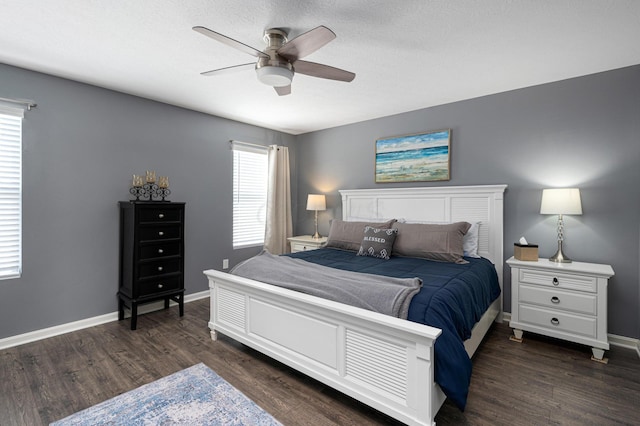 bedroom featuring a textured ceiling, dark hardwood / wood-style flooring, and ceiling fan