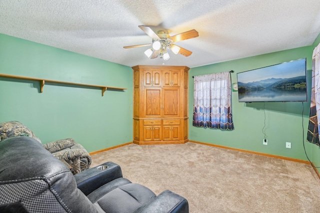 living room with light carpet, a textured ceiling, and ceiling fan