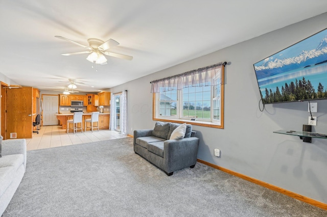 living room featuring ceiling fan and light carpet