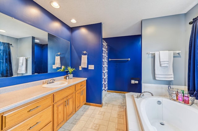 bathroom with vanity and tiled tub