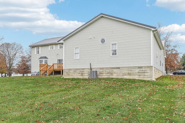 view of side of home featuring a yard