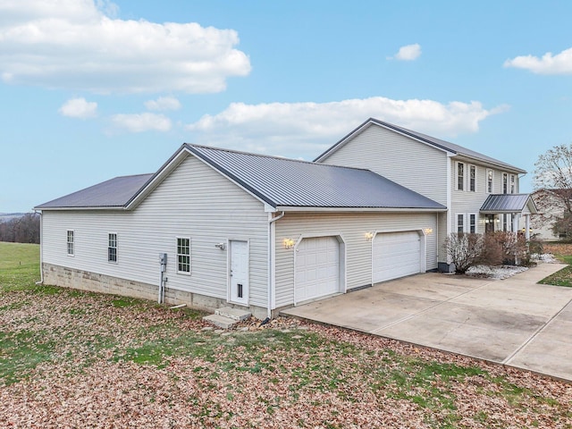 view of home's exterior with a garage