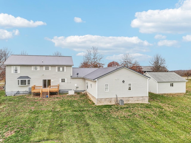 back of house with a yard and a deck