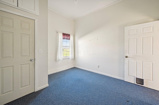 carpeted empty room featuring ornamental molding