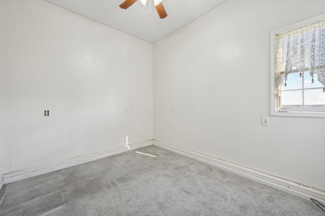 spare room with ceiling fan, carpet, and lofted ceiling