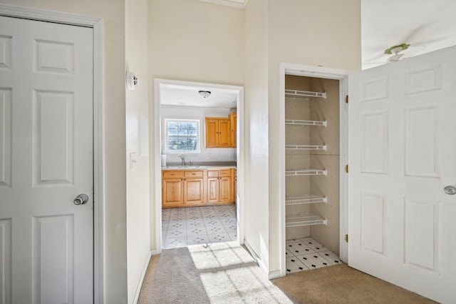 interior space with tile patterned floors and sink