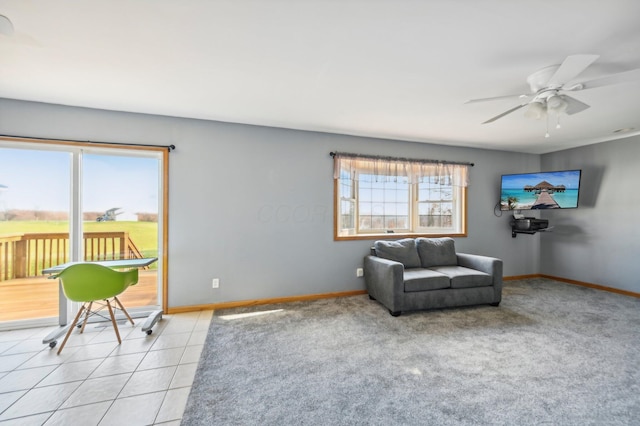 tiled living room featuring ceiling fan