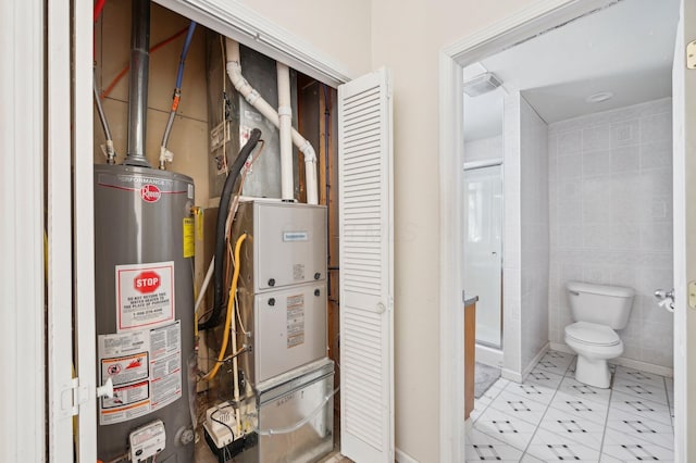 utility room featuring gas water heater