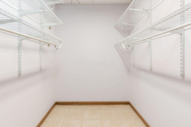 walk in closet featuring tile patterned floors