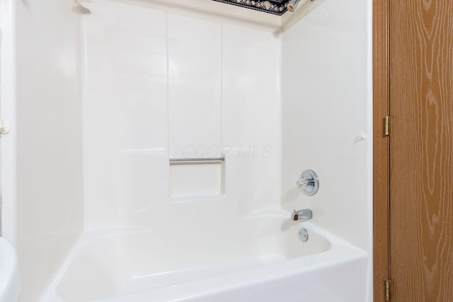 bathroom featuring shower / washtub combination