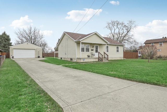 view of front facade with a garage, an outbuilding, and a front yard