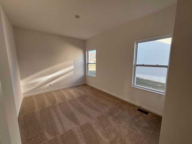 empty room featuring carpet