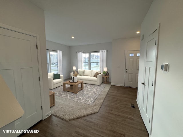 living room featuring dark hardwood / wood-style floors