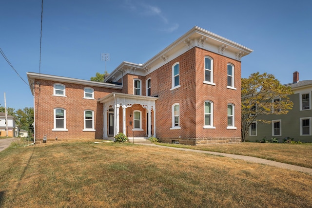 italianate-style house with a front yard