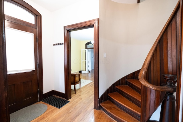 foyer entrance with light hardwood / wood-style floors