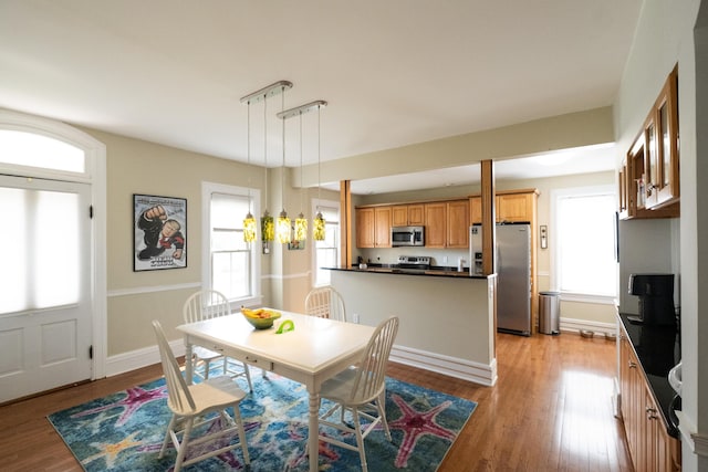 dining room with light wood-type flooring