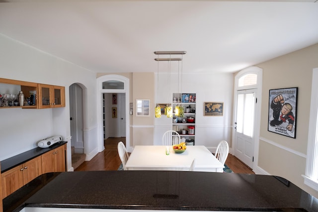 dining space featuring dark hardwood / wood-style floors