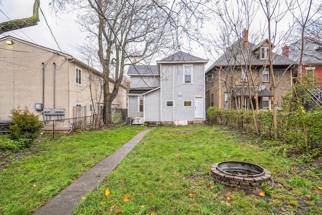 view of yard with a fire pit