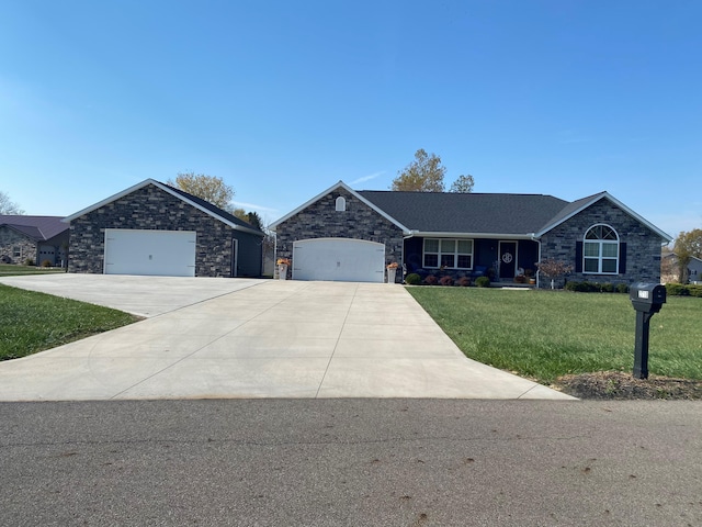 ranch-style home featuring a front yard and a garage