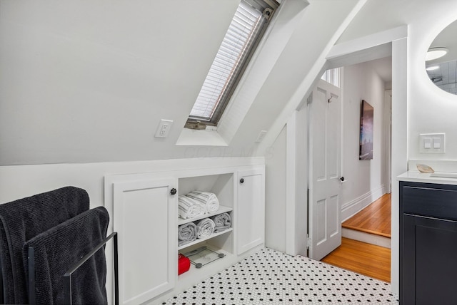 1030 Jaeger St, Columbus, OH 43206 - bathroom featuring a skylight and vanity