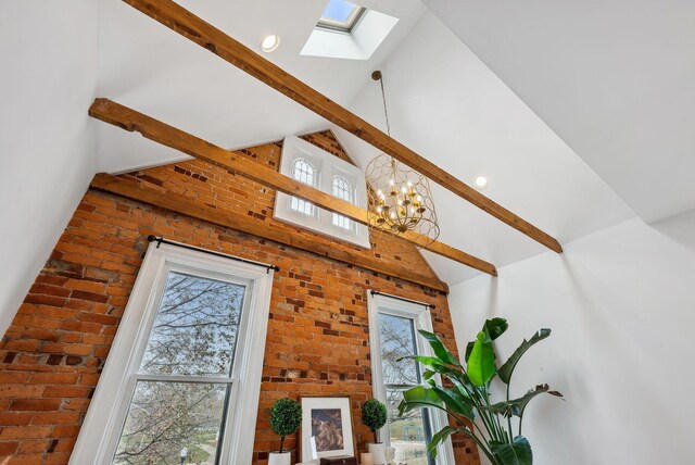 1030 Jaeger St, Columbus, OH 43206 - detailed view of a skylight, brick wall, a chandelier, and beamed ceiling