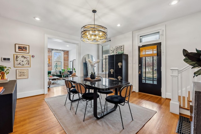 1030 Jaeger St, Columbus, OH 43206 - dining room featuring light wood-type flooring, a chandelier, plenty of natural light, and recessed lighting