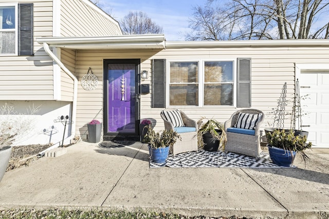 view of exterior entry with a garage