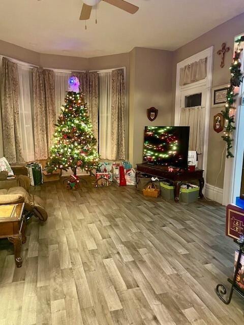 sitting room featuring hardwood / wood-style flooring and ceiling fan