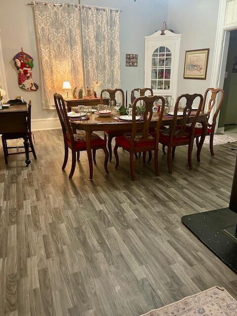 dining area with wood-type flooring