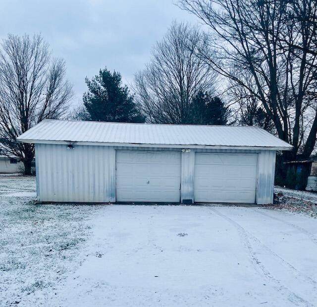 view of snow covered garage