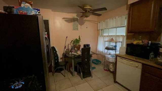 kitchen with dishwasher, stainless steel refrigerator, ceiling fan, and light tile patterned flooring