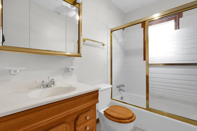 full bathroom featuring vanity, toilet, and bath / shower combo with glass door