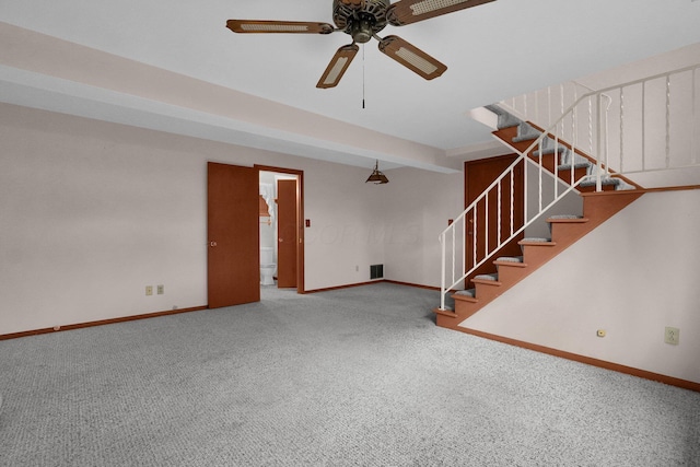 interior space with carpet flooring and ceiling fan