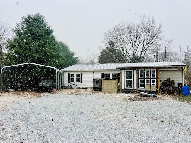 view of front of home with a carport