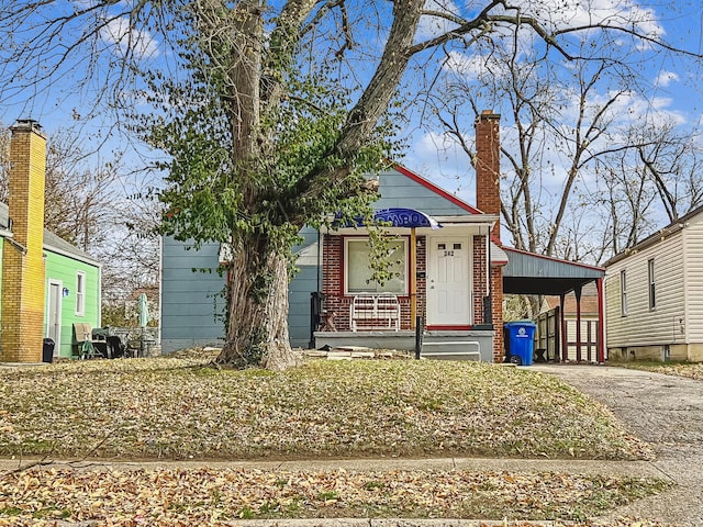 view of front of home featuring a carport