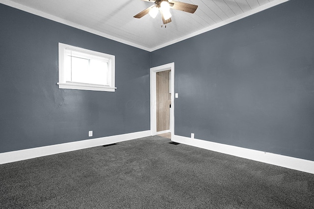 carpeted spare room with ornamental molding and ceiling fan