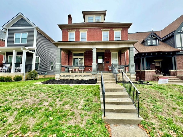 view of front of property featuring a porch and a front yard