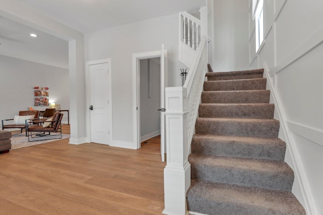 stairway featuring hardwood / wood-style floors