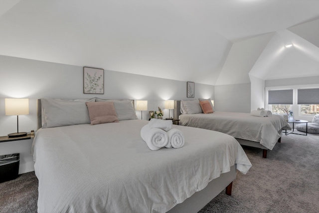 carpeted bedroom featuring lofted ceiling