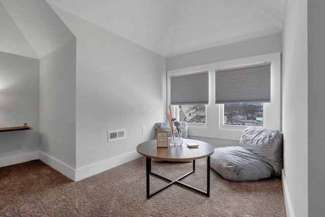 living area with carpet flooring and lofted ceiling