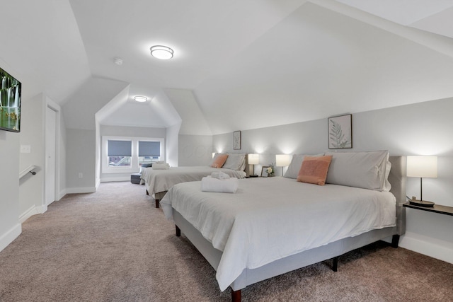 bedroom featuring carpet and vaulted ceiling