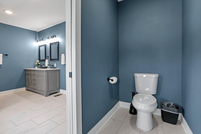 bathroom with vanity and toilet