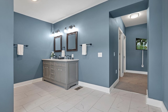 bathroom featuring vanity and vaulted ceiling