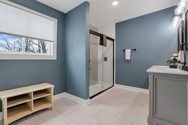 bathroom featuring vanity and an enclosed shower